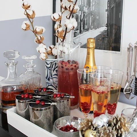 Tray of cocktails on top of bar cart.