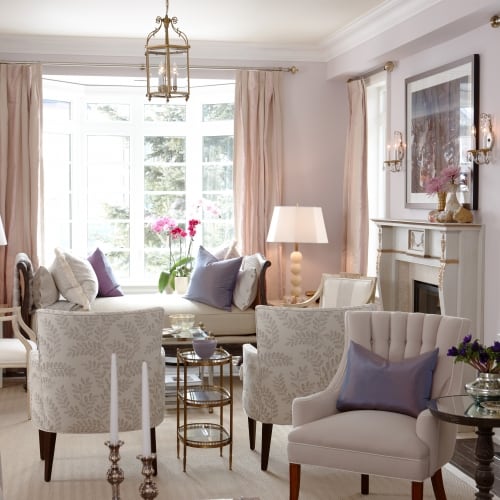 Sitting room showing a sitting room with chairs and a lounge with a bay window in the background